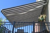 a folding awning over a balcony