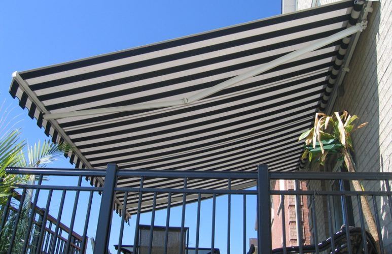 a folding awning over a balcony
